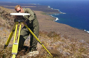 Cervelli in traditional Hawaiian garb setting up a GPS monitor