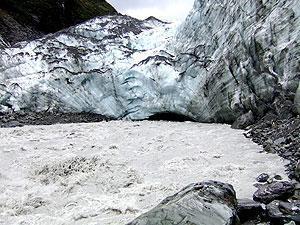 Sediment-charged waters disgorge from beneath the Franz Josef Glacier, New Zealand. (Credit: Damon Teagle) 