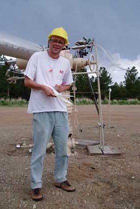 Team member Greg Holland collecting volcanic carbon dioxide from a natural gas field in Colorado in 2003. Similar samples from the Bravo Dome gas field in New Mexico provided noble gas samples for the present geochemical research